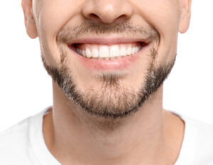 Man with healthy smile after cavity treatment in Mount Pleasant, Michigan