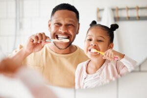Family with healthy teeth in Mount Pleasant, MI